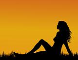 Girl silhouette on grass