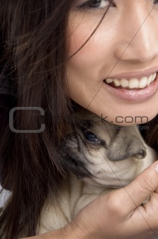 pretty woman holding puppy