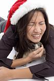 female with christmas hat and playing with pug