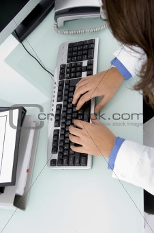 doctor's hand on keyboard