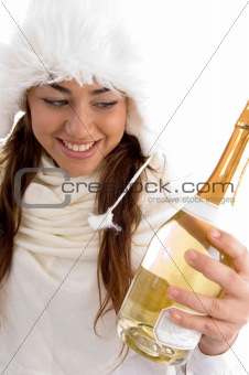 smiling female holding champaign bottle