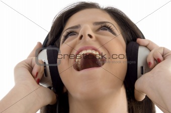 young woman listening music in headset
