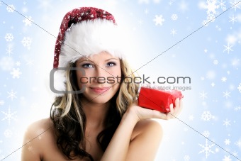 portrait of a woman with a gift in her hand and snowflakes