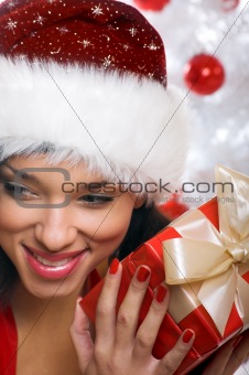 woman with a gift and a tree