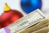 Money and Christmas Ornaments with Narrow Depth of Field.