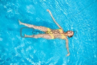 Beautiful Woman Swimming in Pool