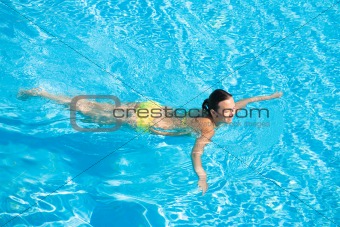 Beautiful Woman Swimming in Pool