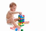 Child builds the house of the cubes