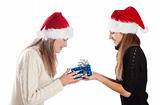 Young woman giving Xmas present to her friend