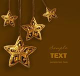 Gold beaded stars isolated on white