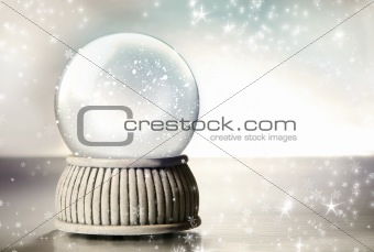Snow globe against a silver background