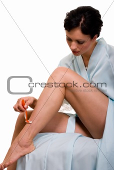 Woman shaving legs