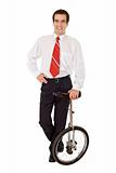 Balance in business - businessman with monocycle