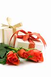 red roses and gift box on white background