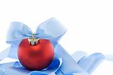Red christmas decoration with soft blue ribbon