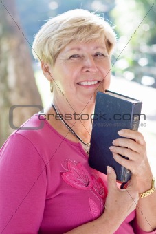 elderly woman reading bible
