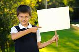 The boy is holding a white blank board