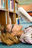 young african student reading in library