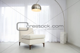 Contemporary interior with lamp and chair