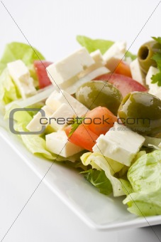 detail of a greek salad on a plate