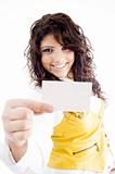 successful female holding business card and showing in front of 
