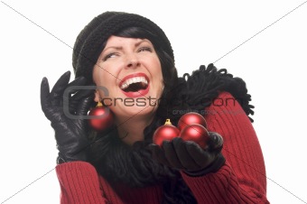 Attractive Woman Holding Red Ornaments Isolated on a White Background.