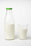 pouring fresh glass of milk isolated 