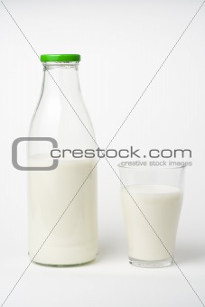 pouring fresh glass of milk isolated 