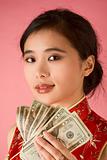 Chinese woman with US money 20 dollar bill