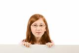 Blank sign - red head girl in glasses (with copy space)