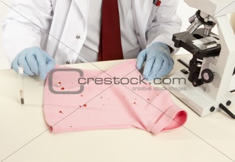 Forensic swabbing a stain
