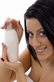 portrait of woman with lotion bottle