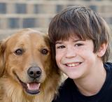 Boy Smiling With Dog