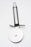 shiny metal pizza cutter isolated