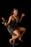 Ecstatic African-American woman with rose flower