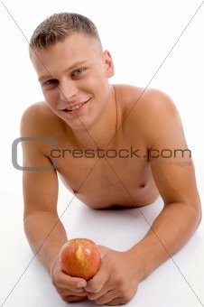 laying fit guy with apple