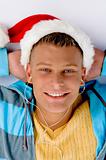 blonde man with christmas hat and ear phones