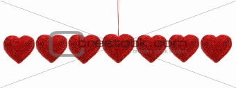Red beaded hearts isolated against white