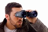 side view of man looking through binoculars 
