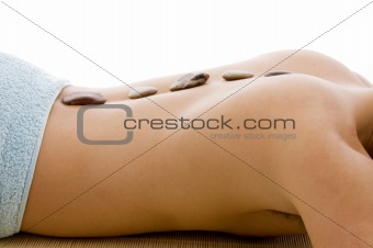 side view of  man lying down for spa treatment 