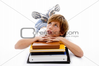 front view of laying boy with books 