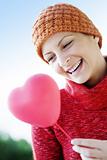 woman with heart balloon