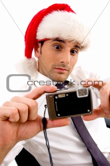 young photographer holding digital camera