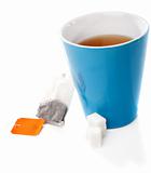 Tea cup, tea bag and sugar