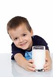 Happy kid with a glass of milk