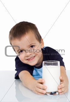Happy kid with a glass of milk