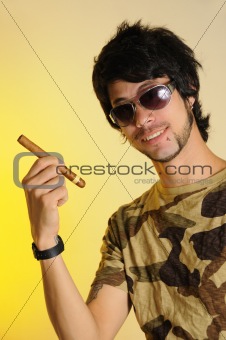 Young man holding cigar