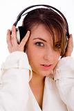 front view of happy woman listening music