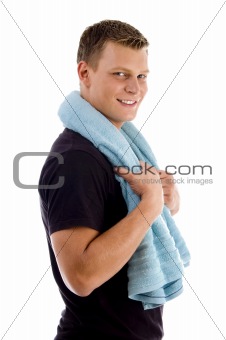 side view of handsome male holding towel