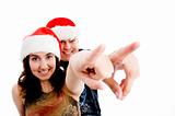 portrait of pointing couple with christmas hat